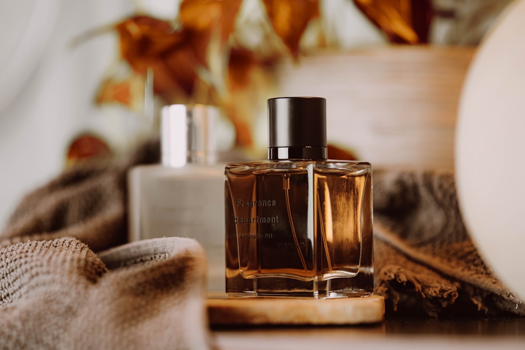 a-bottle-of-perfume-sitting-on-top-of-a-table-ufuchdzawng
